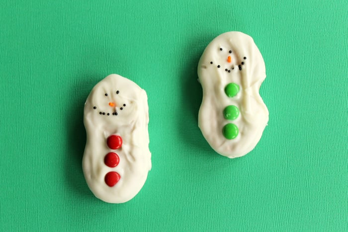 snowman christmas cookies on green surface