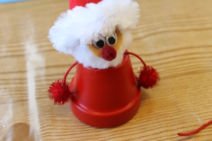 finishing the clay pot santa