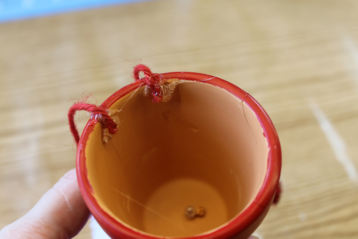 adding legs to a clay pot craft