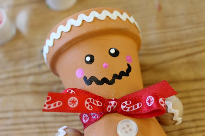 This DIY terra cotta gingerbread man is perfect for your Christmas and holiday decor!