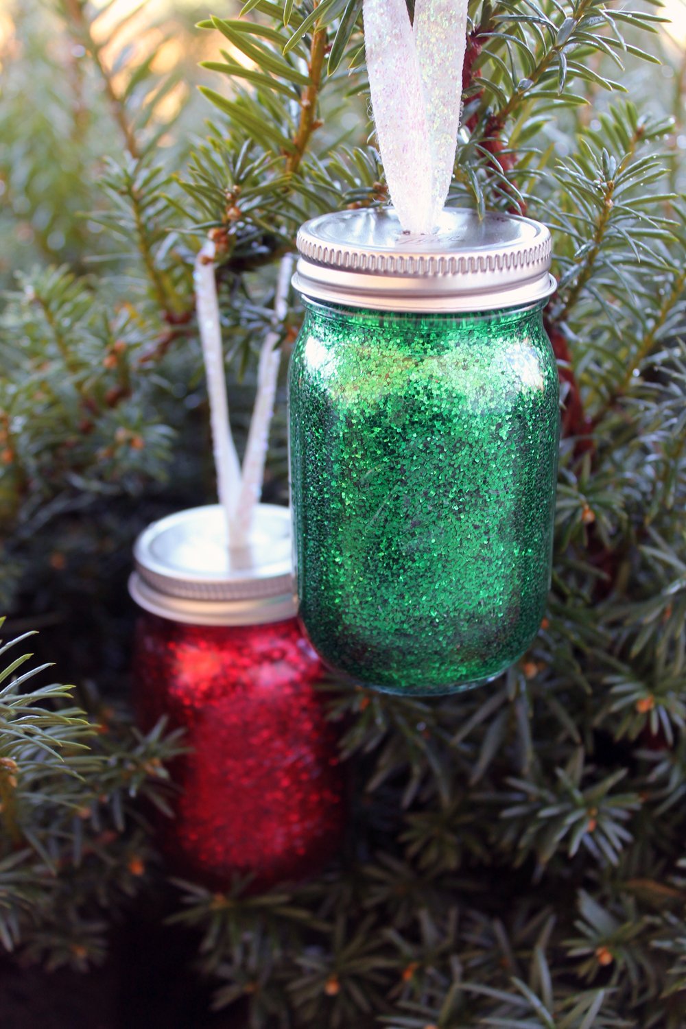 glitter mini mason jar ornaments hanging on tree