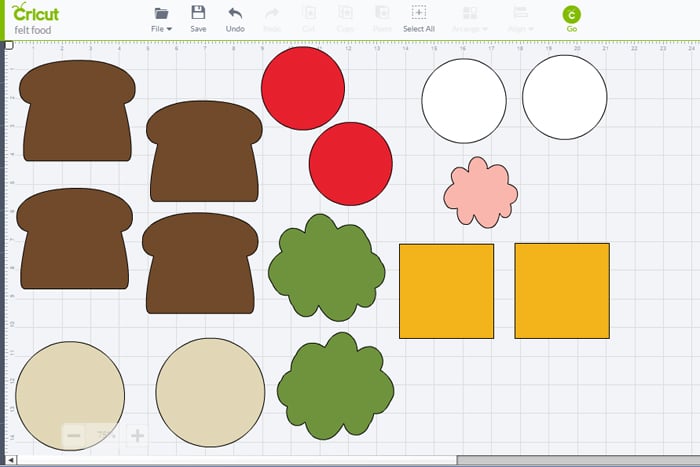 Use Cricut Design Space to create felt food shapes like bread, cheese, and lettuce 