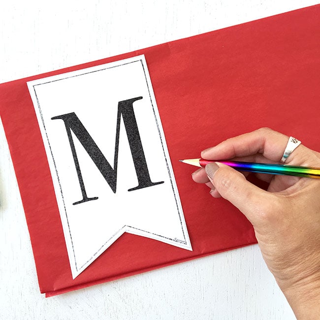 Print and trace letter pennant on to tissue