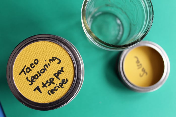 labeling jars with taco seasoning and salsa