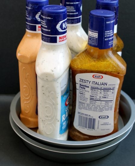 Dollar store lazy susan organizing idea - an inexpensive way to organize your kitchen cabinets!