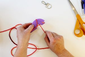 Learn how to make a pom pom key chain with a pom pom maker!