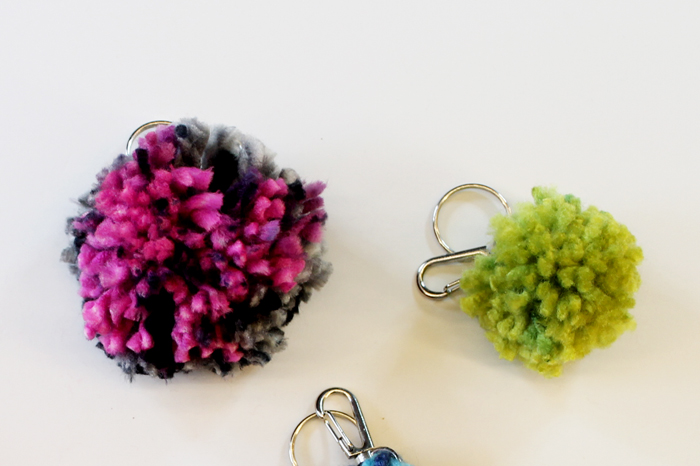 close up shot of yarn pom pom keychains