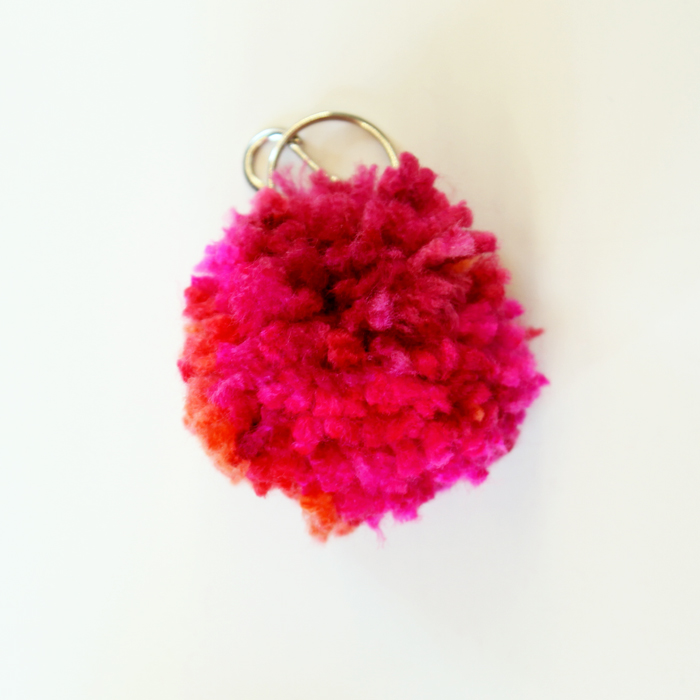 close up shot of yarn pom pom keychains