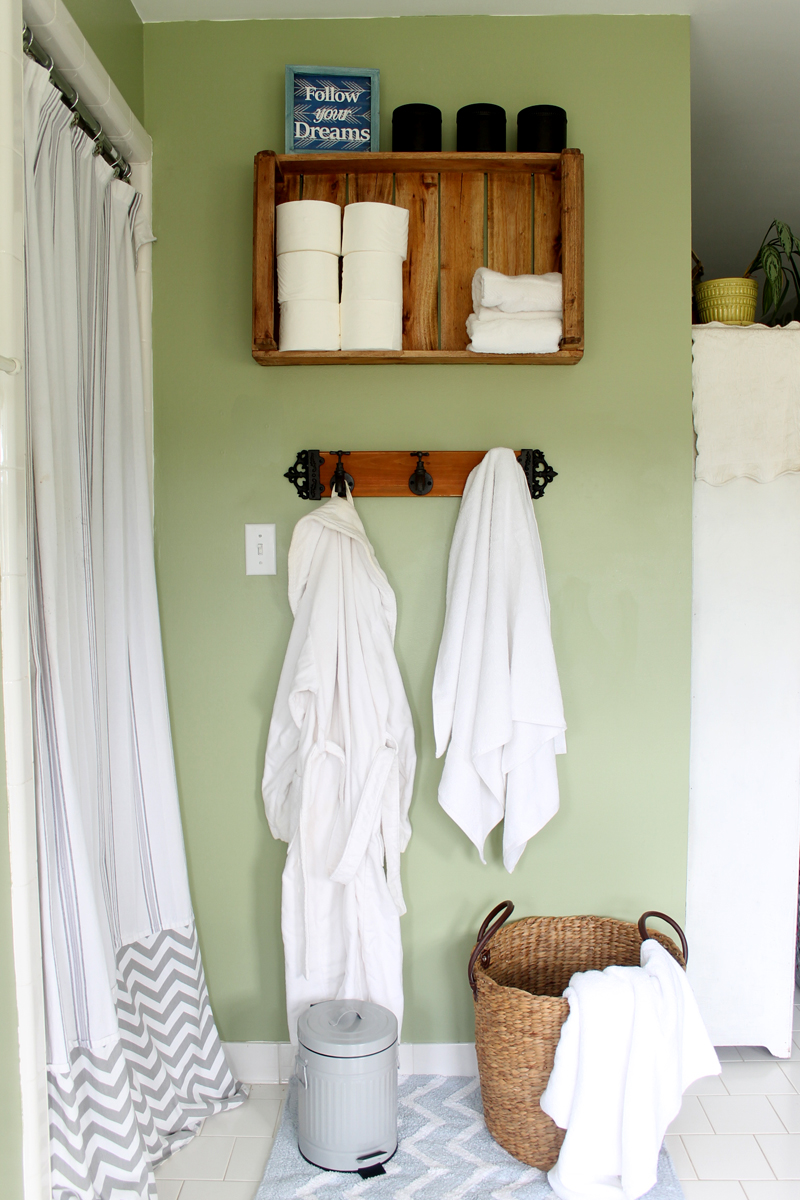 A rustic crate makes a create bathroom shelf, adding extra storage and a rustic touch.