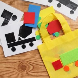 Toddler Busy Bag - make these truck shapes to keep your toddler busy anywhere that you go! A fun activity for those in pre-school!