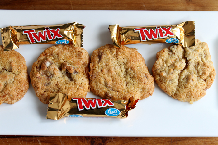 Twix Cookies on a white plate with twix bars
