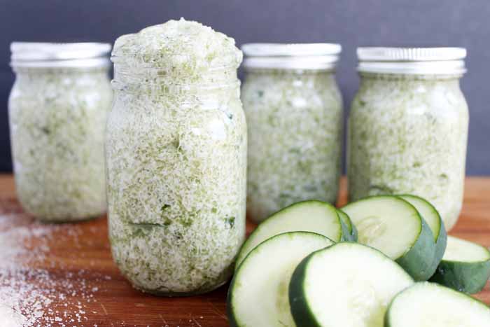 four jars of sugar scrub with cucumers