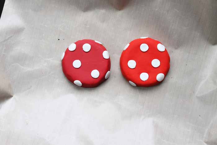 mason jar lids covered in red and white clay