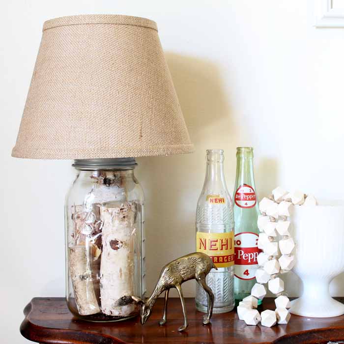 Mason jar table lamp on side table