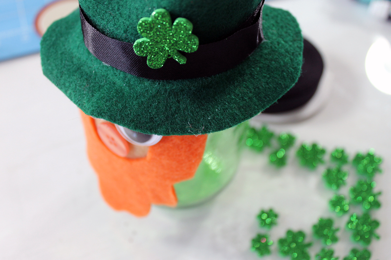 adding shamrock sticker to a hat