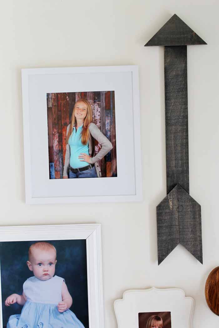 wall decor picture collage with arrow