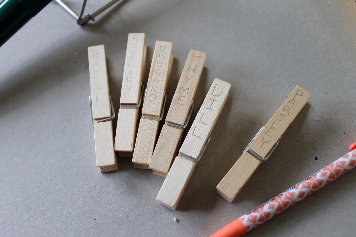 Herb garden design - make a rustic herb garden with an old wheel! Plus instructions on making clothespin herb markers!