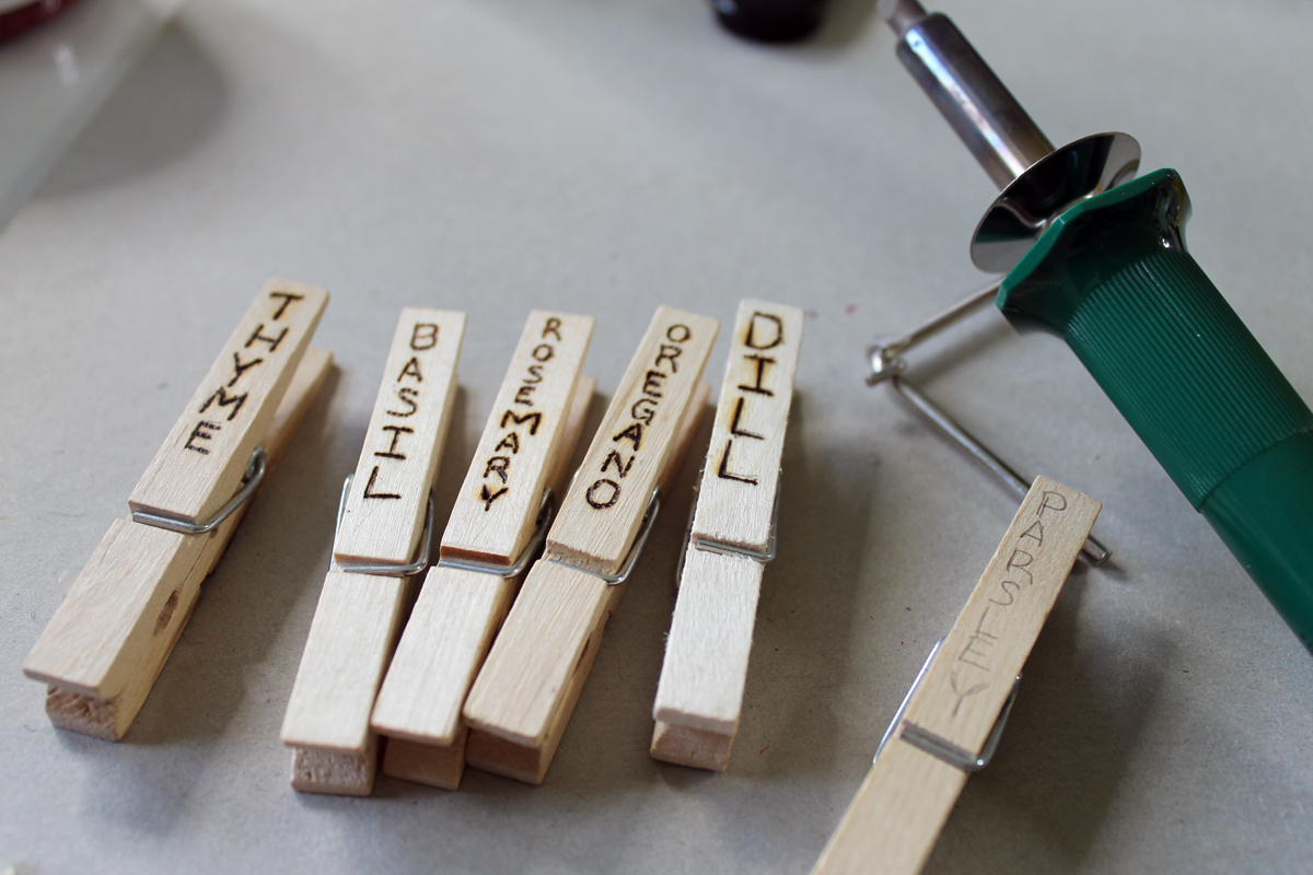 Herb garden design - make a rustic herb garden with an old wheel! Plus instructions on making clothespin herb markers!