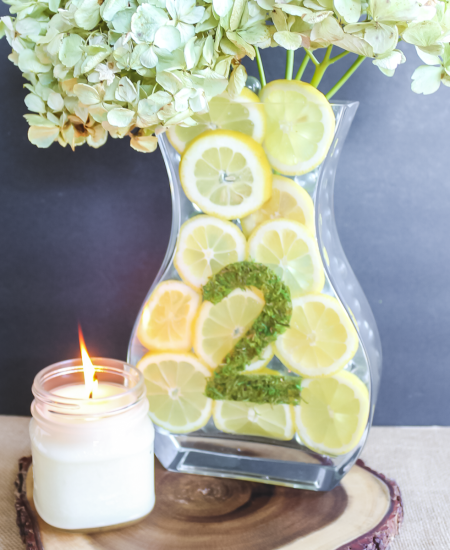 lemon centerpiece on a rustic wood slice