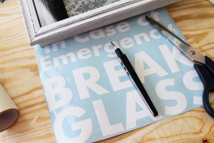 Using your Cricut, cut the shawdowbox lettering from a vinyl sheet. 