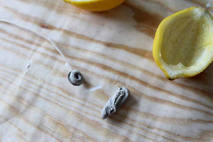 adding wick to the lemon peel