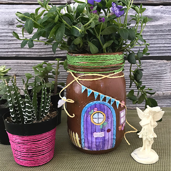 This mason jar fairy house is the perfect addition to any kind of fairy garden landscape