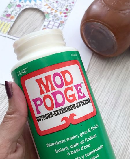 A close up of a bottle of Mod Podge