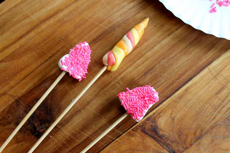 candy unicorn horn and ears on wooden skewers for unicorn drink