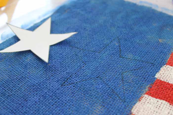 tracing star onto burlap flag