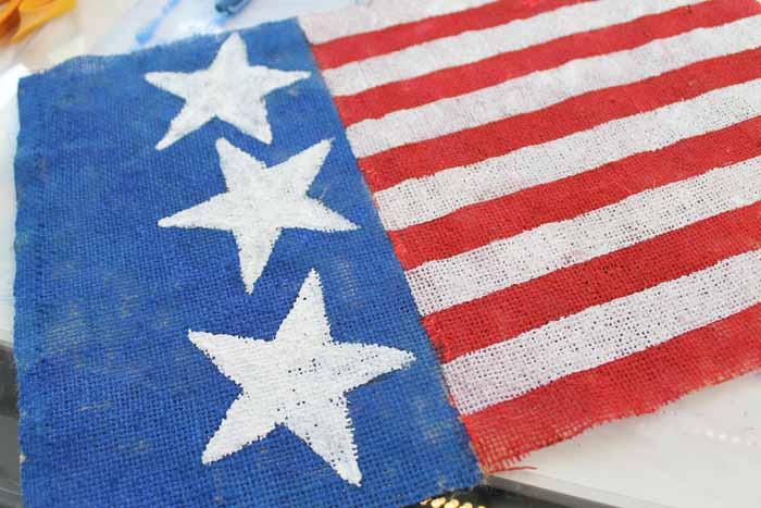 painting stars on burlap flag