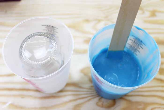 stirring silicone rubber inside a mixing cup