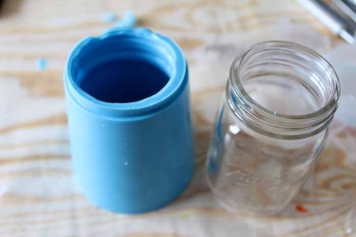 candle mold and mason jar next to each other