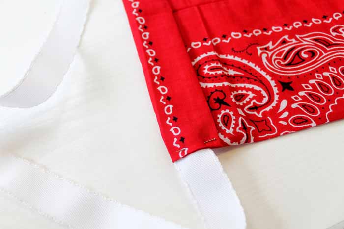 red bandanna with white ribbon