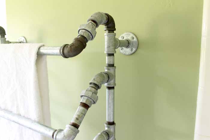 This rustic towel rack is make with galvanized pipes