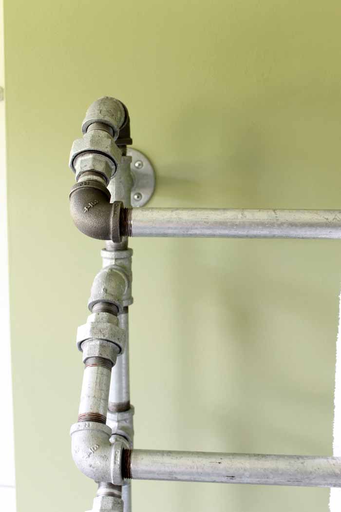 We used standard galvanized pipe connections to make a rustic pipe towel rack