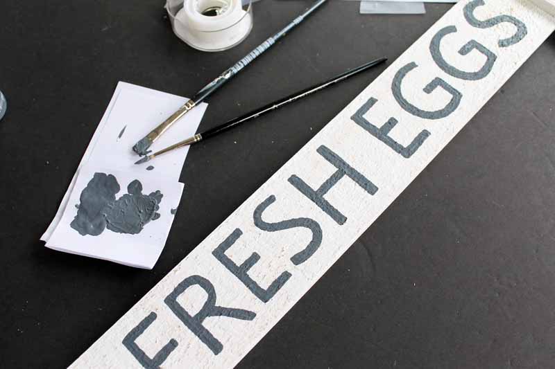 painting fresh eggs sign