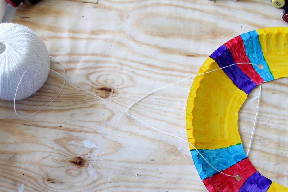 Add kite string to your paper plate kite body