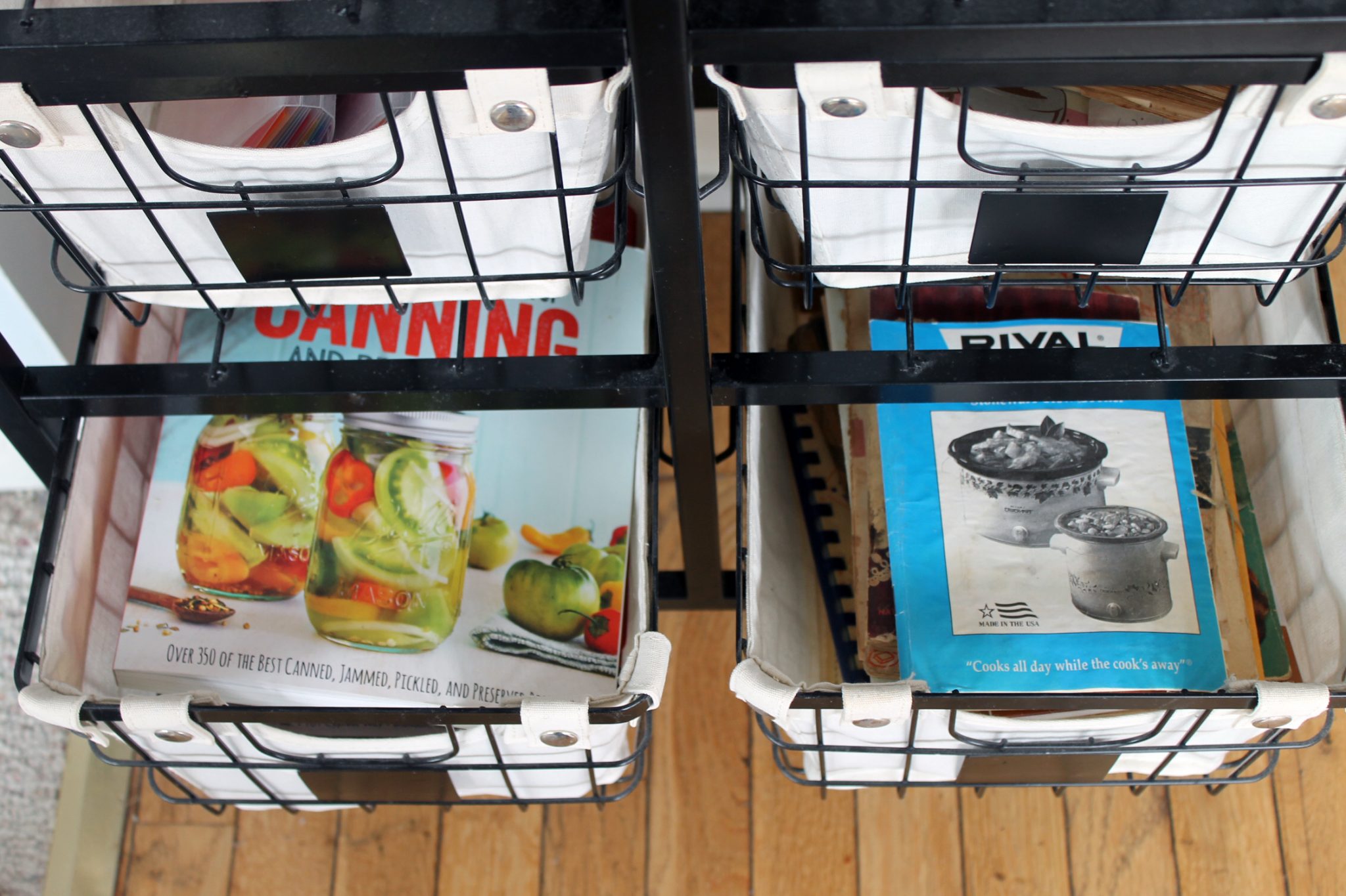 drawers in a kitchen filled with cookbooks