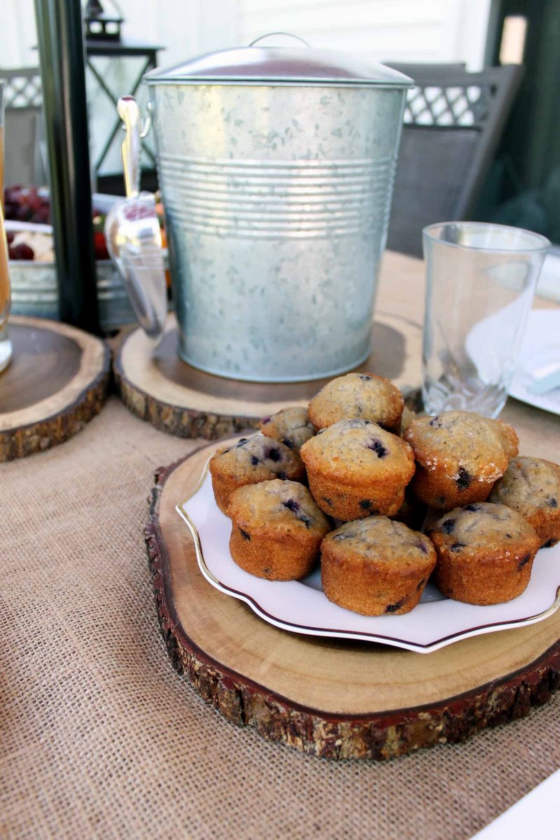 wood charger with muffins on a plate