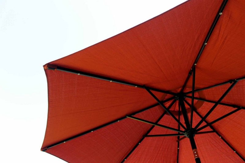 orange patio umbrella with lights