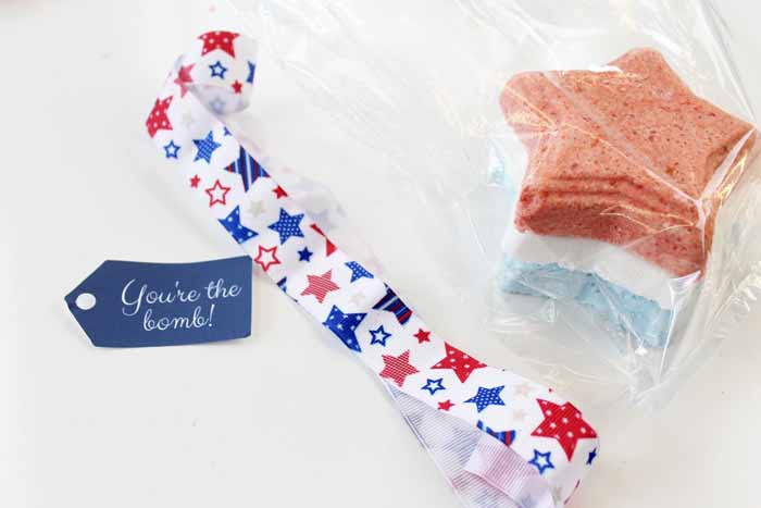 packaging up a set of red white and blue bath bombs