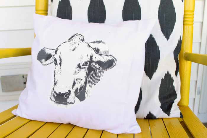 Make this farmhouse pillow for your home in a few simple steps! You will love the cow silhouette!