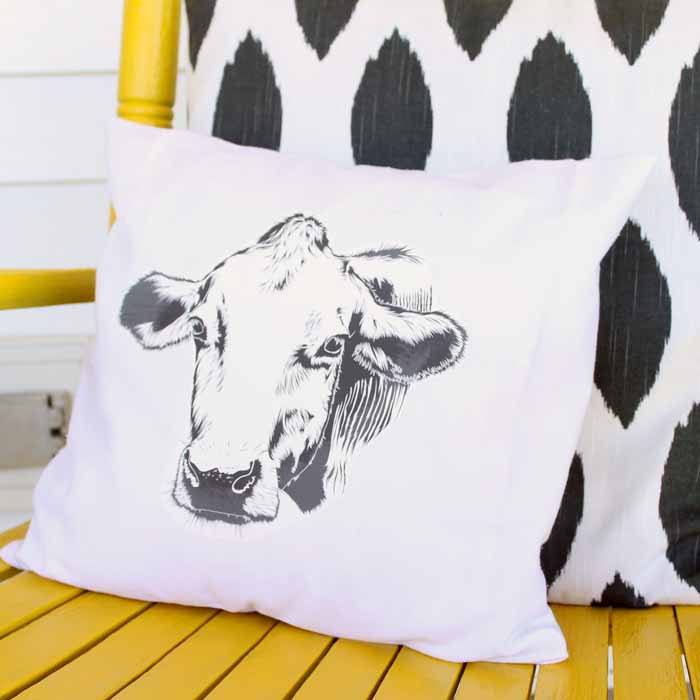 Make this farmhouse pillow for your home in a few simple steps! You will love the cow silhouette!