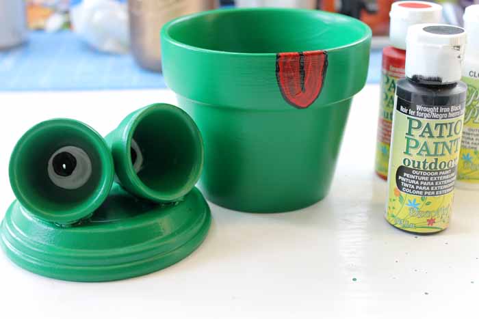 add eyes and tongue to flower pot frog