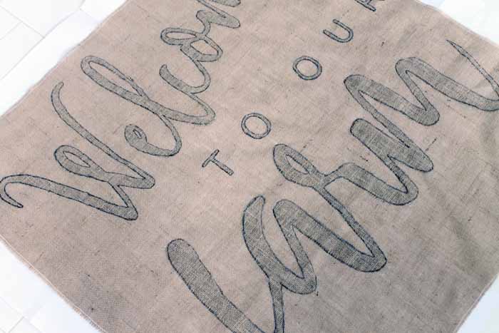 tracing letter with sharpie on burlap
