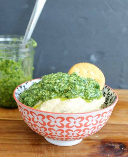 Making pesto with basil! Top hummus for an amazing snack!