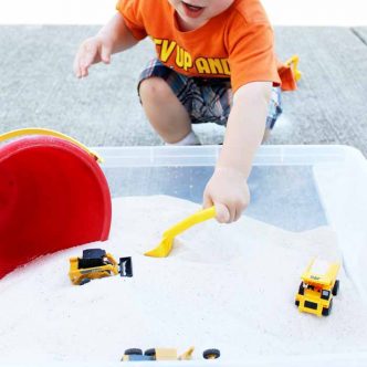 Kid scooping sand