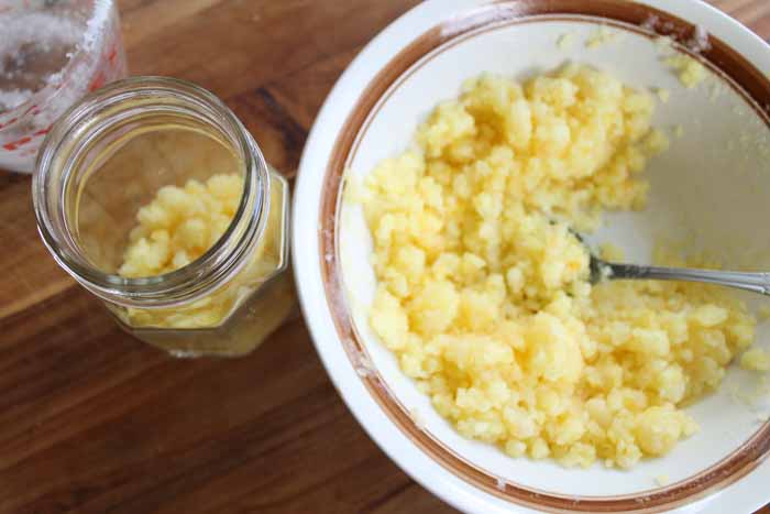 white bowl with pineapple sugar scrub ingredients. 