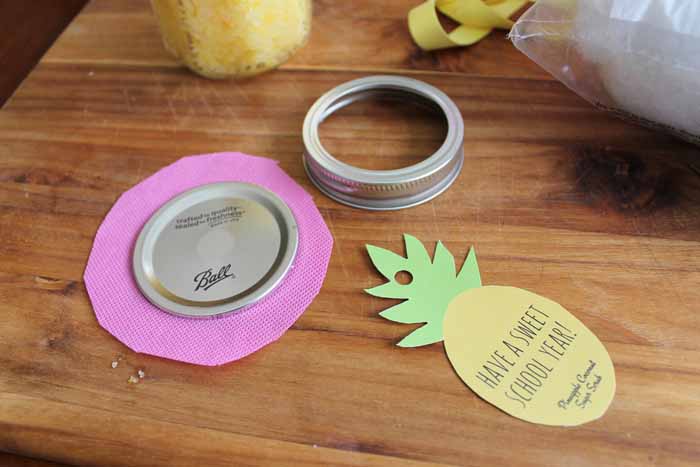 pink fabric under mason jar lid. Pineapple gift tags. 