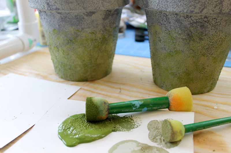 dot sponge with green paint and concrete planters